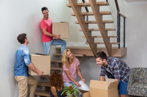 Removalists loading household furniture for a local move in To