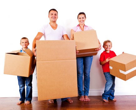 Movers To team beginning a sustainable move with reusable packing materials