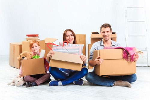 House removals team preparing furniture for a local home move in To