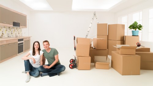 Local man and van team handling boxes and household items