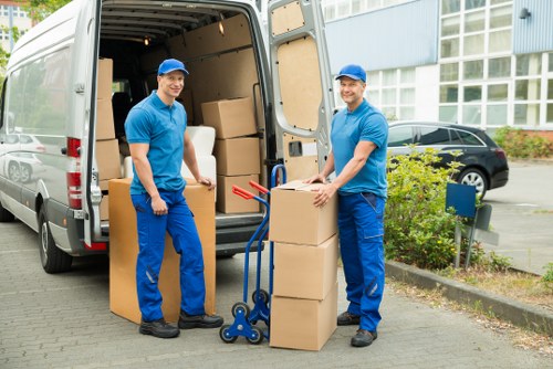 Office furniture being carefully loaded for a move from a property in To
