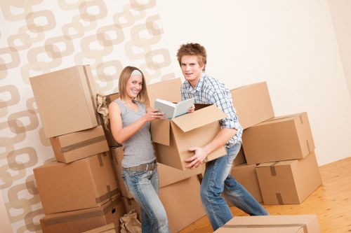 Professional movers handling furniture carefully during a house move