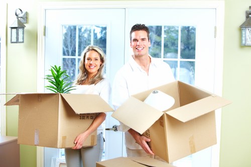 Movers organizing belongings in a new home during setup