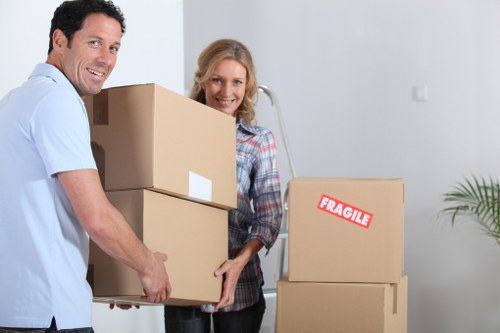 Furniture and boxes loaded into a van for transport in To